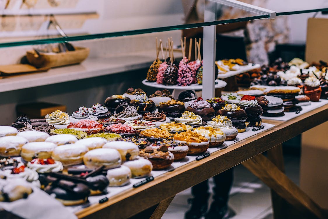 display of different varieties of donuts in a shop